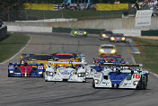 Pole winner James Weaver leads the field into turn one at the start