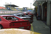 Lots of Ferrari parking in the pit Lane