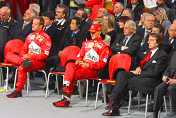 Rubens Barrichello, Michael Schumacher and Luca di Montezemolo in the front row