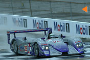 Allan McNish sends up water as he drives the Audi UK Team  Veloqx entry during Tuesday testing at Sebring