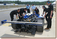 The Dyson Racing crew makes adjustments to its Lola-MG Prototype during Tuesday's American Le Mans Series testing session at Road Atlanta.