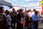 Fans in front and behind the fence