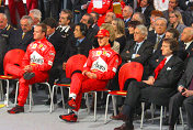 Rubens Barrichello, Michael Schumacher and Luca di Montezemolo in the front row