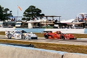 The Doran/Matthews Ferrari 333 SP s/n 026 leads the Champion Porsche 911 GT1 Evo into turn 3.