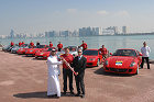 Piero Ferrari passes the baton to the second partecipant in the area where the Ferrari Park and the Formula 1 circuit will be built